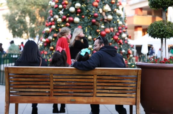 Shoppers browse handcrafted gifts and holiday treasures at the Merry Little Market in Promenade Temecula.